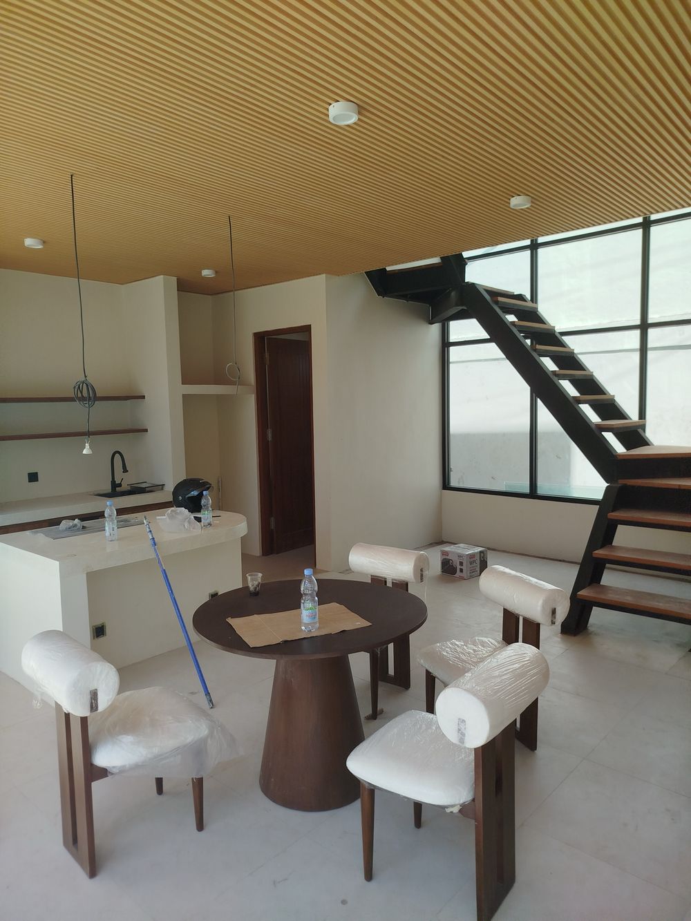 Villa 3 build progress: kitchen and dining under the slatted timber ceiling, stair installed